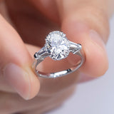 Elena - Oval and Tapered Baguette Three Stone Moissanite Engagement Ring