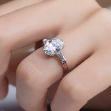 Elena - Oval and Tapered Baguette Three Stone Moissanite Engagement Ring