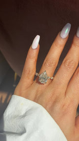 Pear Petal Prongs on Pear Side Stone Band Moissanite Engagement Ring