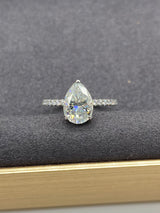 Pear Cut with Hidden Halo on Pave Band Moissanite Engagement Ring