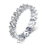 Chloe - Trapezoid Round Moissanite Eternity Wedding Band