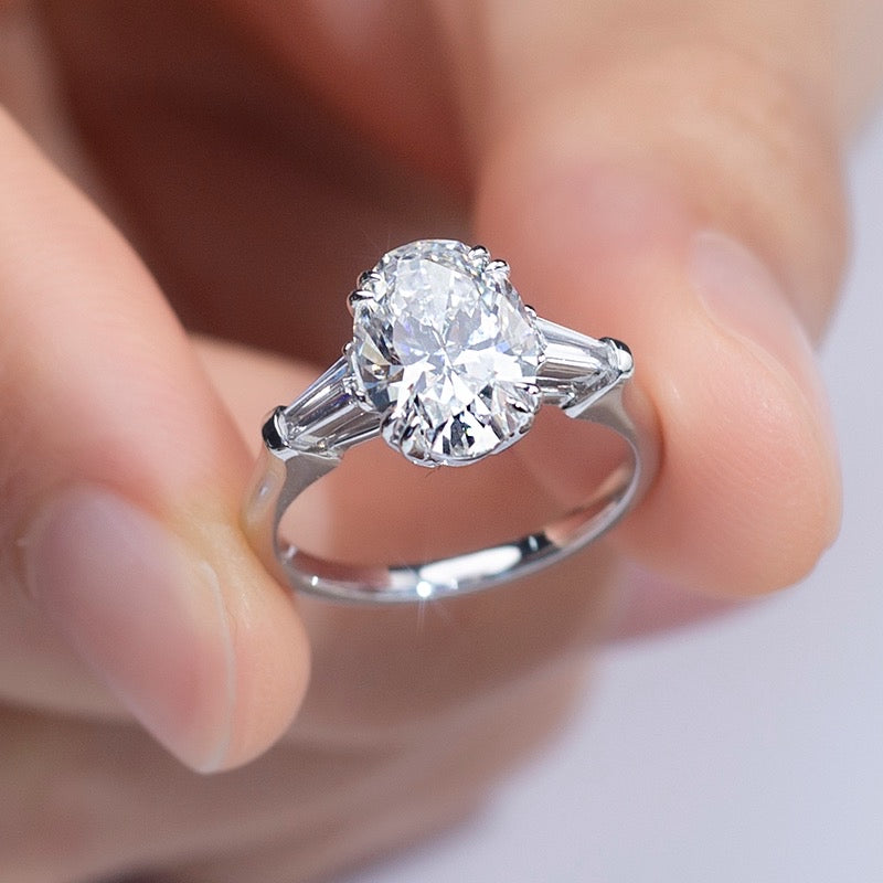 Oval and Tapered Baguette Three Stone Moissanite Engagement Ring