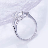 Elena - Oval and Tapered Baguette Three Stone Moissanite Engagement Ring