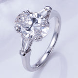Elena - Oval and Tapered Baguette Three Stone Moissanite Engagement Ring