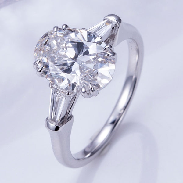 Elena - Oval and Tapered Baguette Three Stone Moissanite Engagement Ring