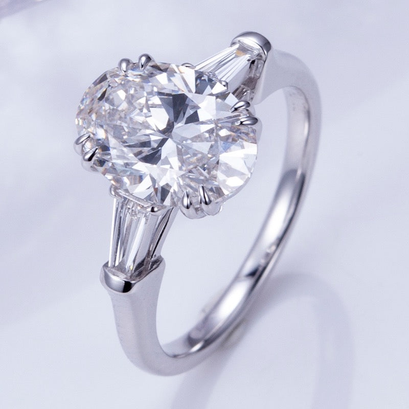 Elena - Oval and Tapered Baguette Three Stone Moissanite Engagement Ring