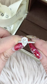 Pear Cut with Hidden Halo on Pave Band Moissanite Engagement Ring