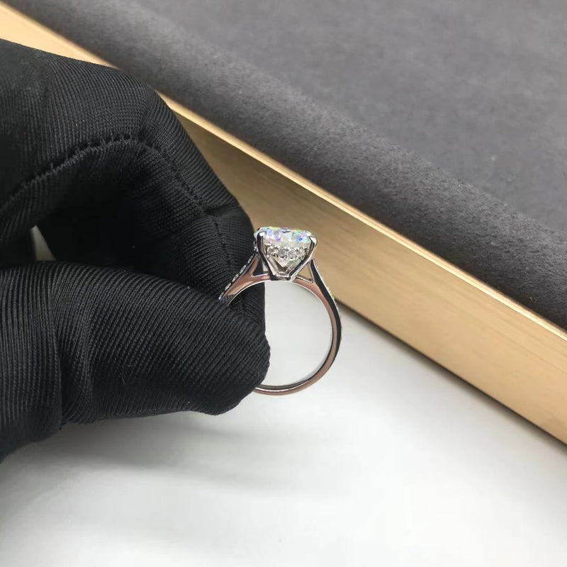 Round Cathedral Moissanite Engagement Ring with Hidden Halo on Pave Band