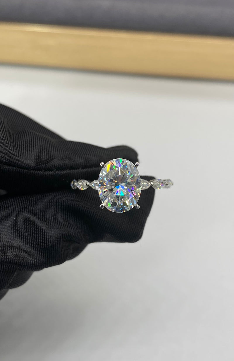 Oval cut hidden halo on Marquise Band Moissanite Engagement Ring